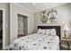 Comfortable bedroom features soft lighting, a decorative painting, and a closet for organized storage at 504 W Ashley Ave, Folly Beach, SC 29439