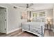 Relaxing bedroom with a fan, windows and queen bed; a peaceful retreat at 504 W Ashley Ave, Folly Beach, SC 29439