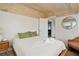 Cozy bedroom with wood ceiling, white walls, and comfortable bed, creating a relaxing retreat at 504 W Ashley Ave, Folly Beach, SC 29439