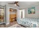 Comfortable bedroom featuring a closet, ceiling fan, and views to an adjacent room at 504 W Ashley Ave, Folly Beach, SC 29439