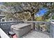 Relaxing deck with a hot tub and a beautiful view at 504 W Ashley Ave, Folly Beach, SC 29439