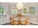Eat in kitchen featuring seating for four around a glass table and bright light at 504 W Ashley Ave, Folly Beach, SC 29439