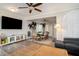 Cozy open-plan living space featuring a large flatscreen TV and dining area with seating for six at 504 W Ashley Ave, Folly Beach, SC 29439