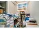 Organized storage closet with towels, cleaning supplies, and beach-themed artwork at 504 W Ashley Ave, Folly Beach, SC 29439