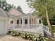 Covered outdoor deck, perfect for entertaining, overlooking a private backyard space at 5079 Coral Reef Dr, Johns Island, SC 29455