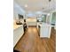 Modern kitchen featuring stainless steel appliances, a large island, and hardwood floors at 5079 Coral Reef Dr, Johns Island, SC 29455