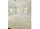 Bright bedroom with neutral walls, a tray ceiling, and natural light streaming through the windows at 5079 Coral Reef Dr, Johns Island, SC 29455