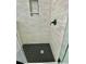 Modern shower featuring decorative tile walls, a built-in shelf, and geometric tile flooring at 5079 Coral Reef Dr, Johns Island, SC 29455