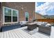 Back deck with outdoor seating, planter boxes, and a fire table, perfect for entertaining at 525 Yellow Tower Ter, Charleston, SC 29412