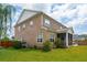 Exterior of a brick home with a well-maintained lawn, landscaping, and a screened porch at 525 Yellow Tower Ter, Charleston, SC 29412