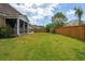 Expansive backyard featuring a well-maintained lawn and a wood fence at 525 Yellow Tower Ter, Charleston, SC 29412