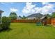 Large backyard featuring a playset and a wood fence, perfect for outdoor activities at 525 Yellow Tower Ter, Charleston, SC 29412