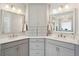 Elegant bathroom featuring dual sinks with white marble countertops and gray cabinetry at 525 Yellow Tower Ter, Charleston, SC 29412