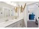 Bathroom with double vanity, stone countertops, view into nautical themed guest room at 525 Yellow Tower Ter, Charleston, SC 29412
