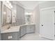 Bathroom featuring elegant gray cabinetry, white marble countertops, and sleek fixtures at 525 Yellow Tower Ter, Charleston, SC 29412