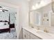 Modern bathroom with double vanity, stone countertops, and view into bedroom at 525 Yellow Tower Ter, Charleston, SC 29412