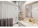 Charming bathroom features a shower with a white subway tile surround, a marble countertop, and gold fixtures at 525 Yellow Tower Ter, Charleston, SC 29412