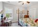 Cozy bedroom features a wood bed frame, a ceiling fan, and a window that lets in natural light at 525 Yellow Tower Ter, Charleston, SC 29412