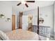 Bedroom featuring four-poster bed, area rug, and view to a bathroom and bedroom at 525 Yellow Tower Ter, Charleston, SC 29412