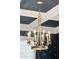 Close up of chandelier in dining room with coffered ceiling and stylish wallpaper at 525 Yellow Tower Ter, Charleston, SC 29412