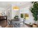 Cozy dining area features a round table, four chairs, and a large window with backyard views at 525 Yellow Tower Ter, Charleston, SC 29412