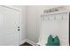 Bright entryway features a hall tree with hooks and a bench, providing a practical and welcoming space at 525 Yellow Tower Ter, Charleston, SC 29412