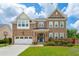 Charming two-story brick home with a well-manicured lawn and a two-car garage at 525 Yellow Tower Ter, Charleston, SC 29412