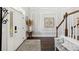 Bright foyer with hardwood floors, white wainscoting, and stairs leading to the second level at 525 Yellow Tower Ter, Charleston, SC 29412