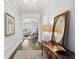 Open foyer showcasing hardwood floors, an elegant light fixture, and a view into the living room at 525 Yellow Tower Ter, Charleston, SC 29412