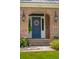 A beautiful blue front door with nice exterior decor, surrounded by brick trim at 525 Yellow Tower Ter, Charleston, SC 29412