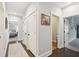 Hallway featuring hardwood floors, neutral paint, and access to various rooms, creating a seamless flow at 525 Yellow Tower Ter, Charleston, SC 29412
