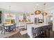 Bright kitchen features white cabinets, stainless appliances, and adjacent breakfast nook at 525 Yellow Tower Ter, Charleston, SC 29412
