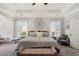 Bright bedroom with large windows, neutral decor, and a seating area, designed for rest and relaxation at 525 Yellow Tower Ter, Charleston, SC 29412