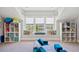 Well lit playroom with window seat, shelves and comfortable seating at 525 Yellow Tower Ter, Charleston, SC 29412