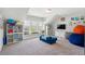 Spacious playroom featuring a window seat, comfortable seating, and plenty of storage space at 525 Yellow Tower Ter, Charleston, SC 29412