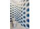 Stylish powder room with blue palm-leaf wallpaper and a modern toilet at 525 Yellow Tower Ter, Charleston, SC 29412