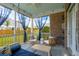 Inviting screened porch with a daybed swing, stylish decor, and ample seating at 525 Yellow Tower Ter, Charleston, SC 29412