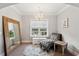 Charming sitting area featuring a tufted chaise lounge, elegant chandelier, and a large decorative mirror at 525 Yellow Tower Ter, Charleston, SC 29412