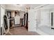 Organized walk-in closet with custom shelves, drawers, and a view of the attached bathroom at 525 Yellow Tower Ter, Charleston, SC 29412