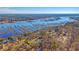 Panoramic aerial view of a waterfront community with docks and stunning water views at 5681 Captain Kidd Rd, Hollywood, SC 29449