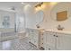 Bathroom with double vanity sinks, modern fixtures, and a large freestanding tub at 5681 Captain Kidd Rd, Hollywood, SC 29449