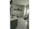 Bathroom featuring dual vanities, marble flooring, and natural light at 5681 Captain Kidd Rd, Hollywood, SC 29449