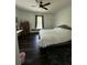 Spacious bedroom with dark wood floors, neutral walls, and a cozy rug at 5681 Captain Kidd Rd, Hollywood, SC 29449