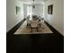 Bright dining room featuring seating for ten with modern decor and hardwood floors at 5681 Captain Kidd Rd, Hollywood, SC 29449