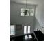 Bright entryway featuring a modern chandelier, double doors, and transom windows, offering plenty of natural light at 5681 Captain Kidd Rd, Hollywood, SC 29449
