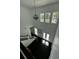 Bright foyer with high ceilings, chandelier, and staircase at 5681 Captain Kidd Rd, Hollywood, SC 29449