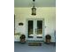 Charming front entrance featuring a light blue door, matching accents, and decorative planters at 5681 Captain Kidd Rd, Hollywood, SC 29449