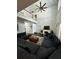 Spacious living room featuring vaulted ceilings, a fireplace and a dark blue sectional sofa at 5681 Captain Kidd Rd, Hollywood, SC 29449