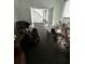 Sitting room with dark hardwood floors, white walls, and massage chair at 5681 Captain Kidd Rd, Hollywood, SC 29449