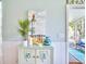 Charming entryway featuring a decorative cabinet and coastal artwork at 6159 Fieldstone Cir, Charleston, SC 29414